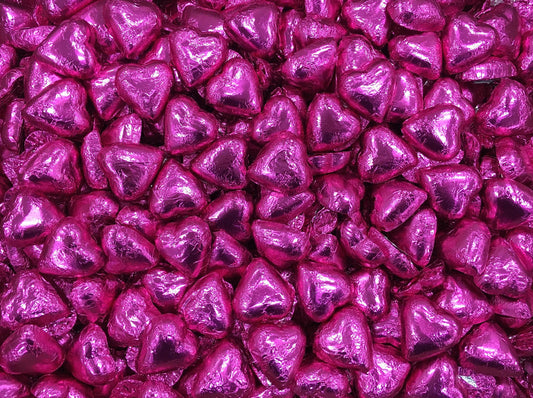 Toms Choc Hearts 1kg hot pink foiled in cello bag