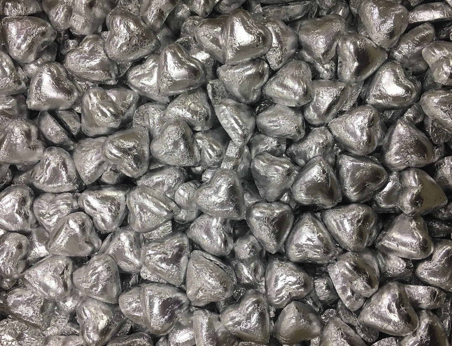 Toms Choc Hearts 1kg silver foiled in cello bag